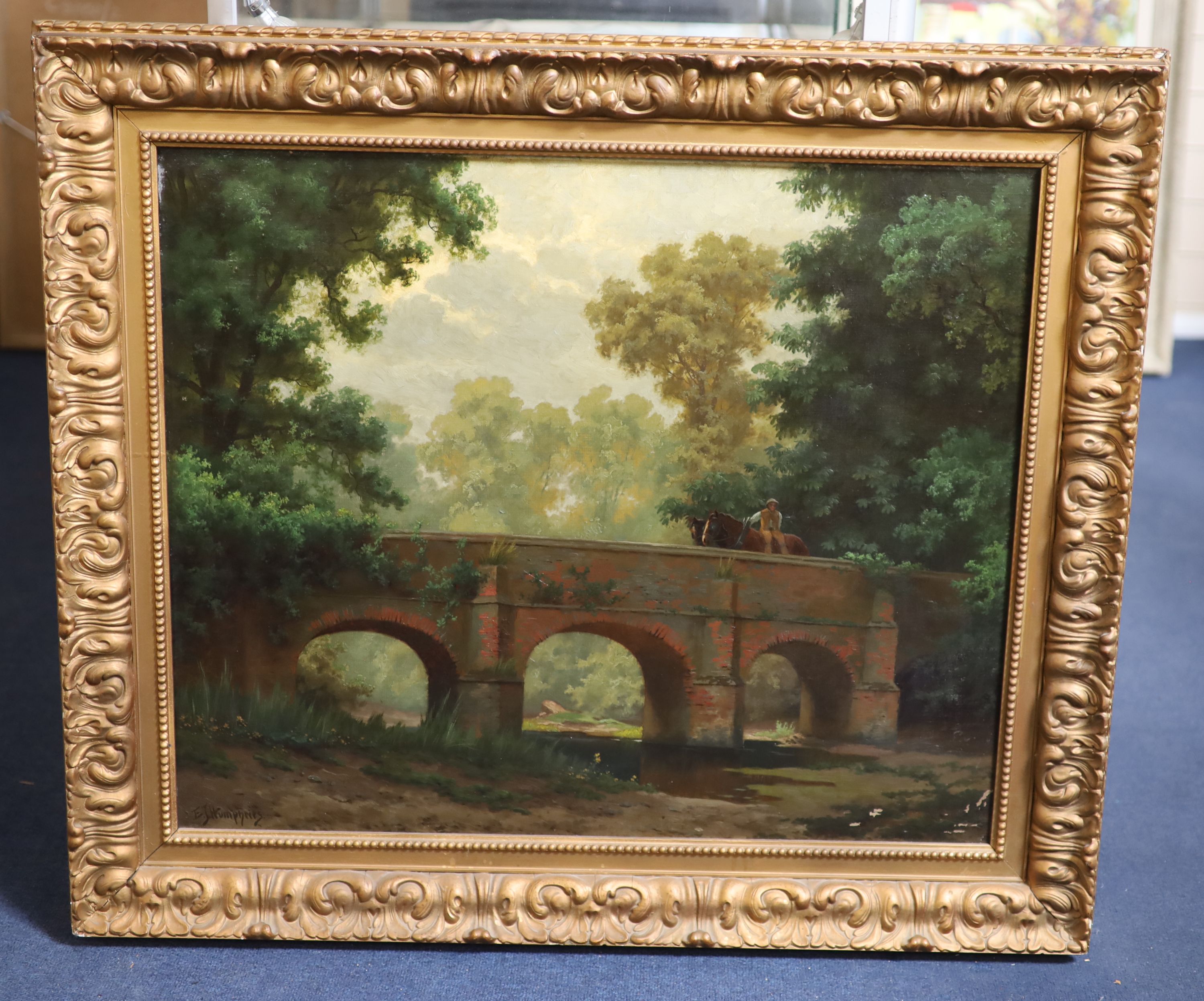 E.J. Humphries, oil on canvas, Horseman crossing a stone bridge, signed, 62.5 x 75cm